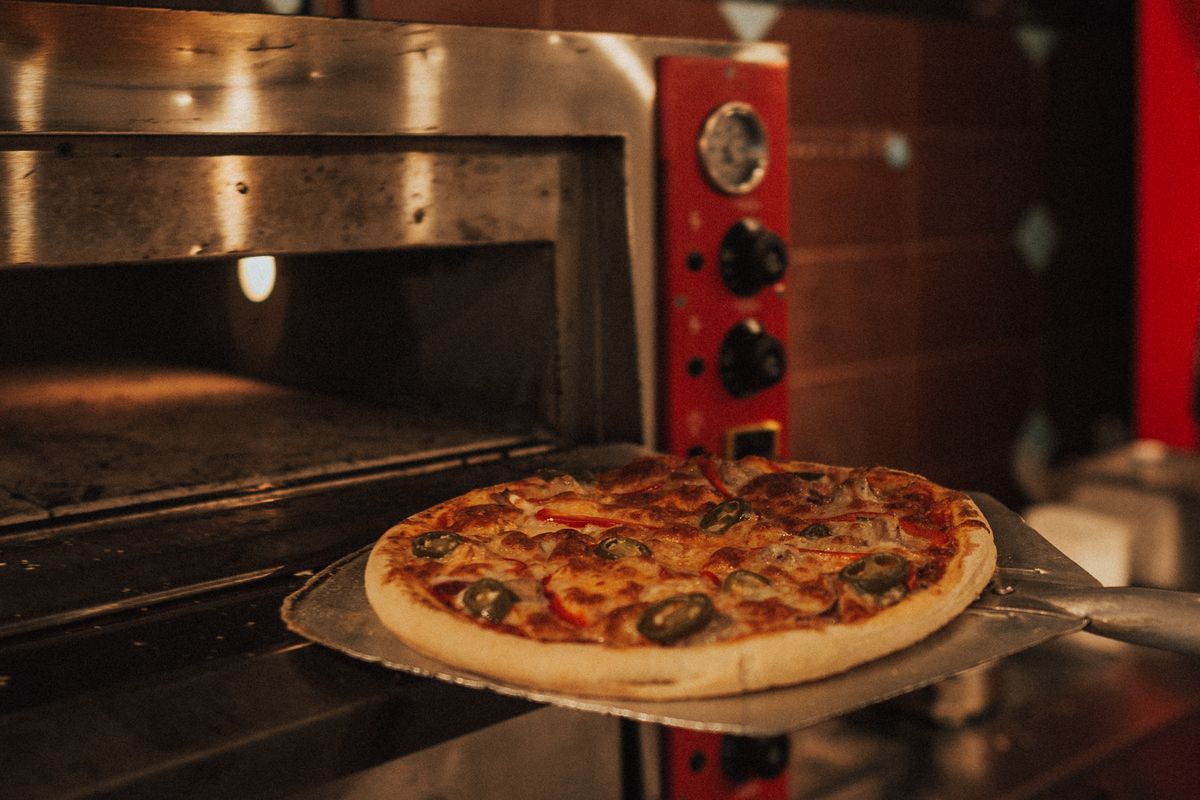 Illustrative Pizza food photo; not a photo of Fuzzy's Pizza Katy